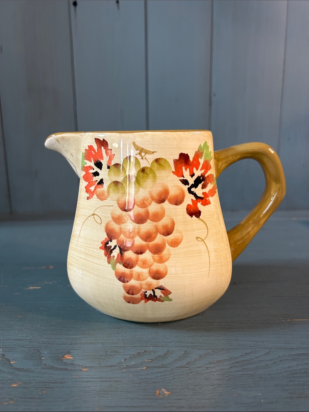 Casa Elite Hand-Painted Cream Ceramic Pitcher with Orange Grape Motif